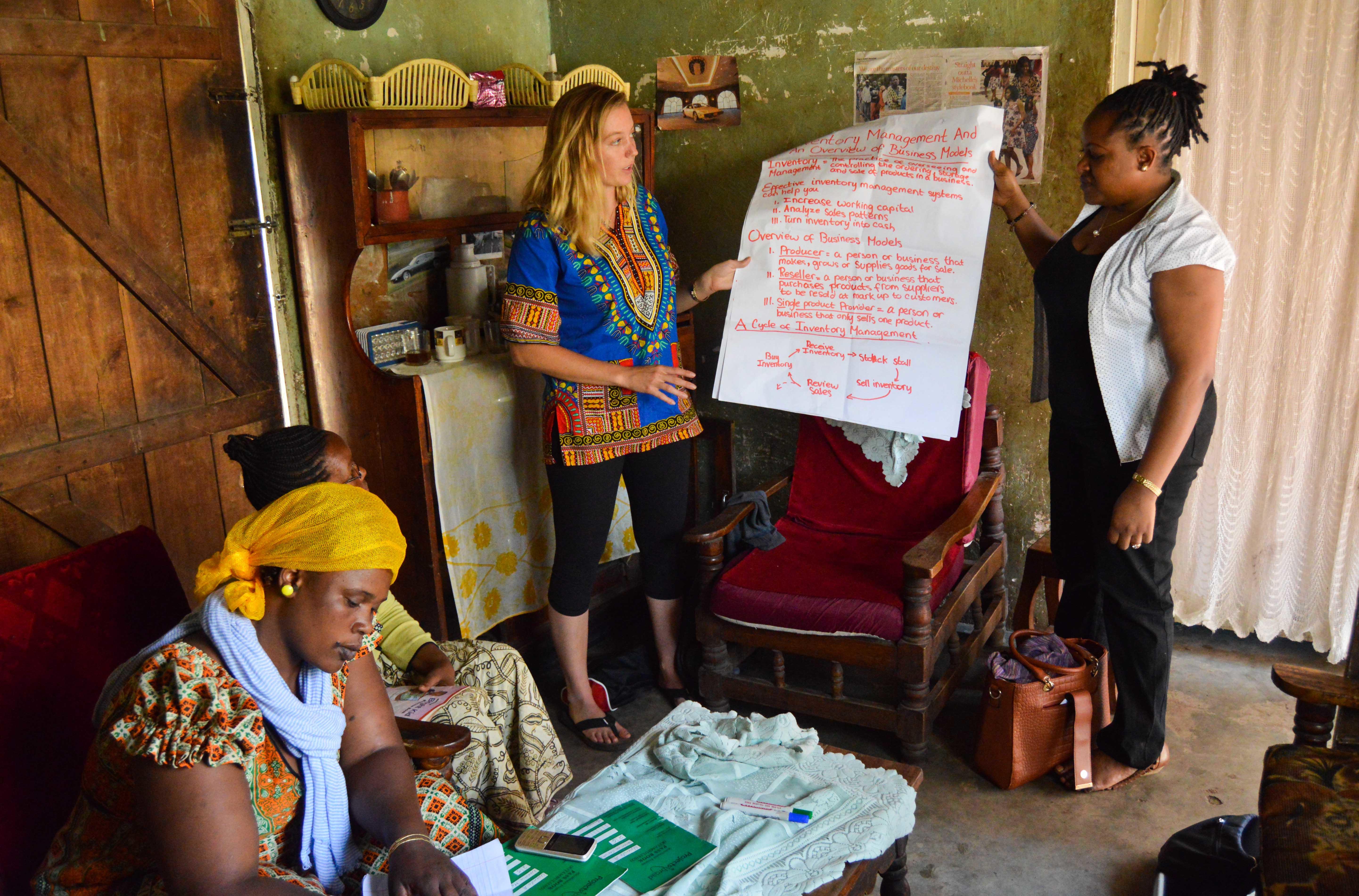 Projects Abroad interns give a presentation to help support entrepreneurs in Tanzania Interns gain micro-finance work experience in Tanzania by giving a presentation to small business owners
